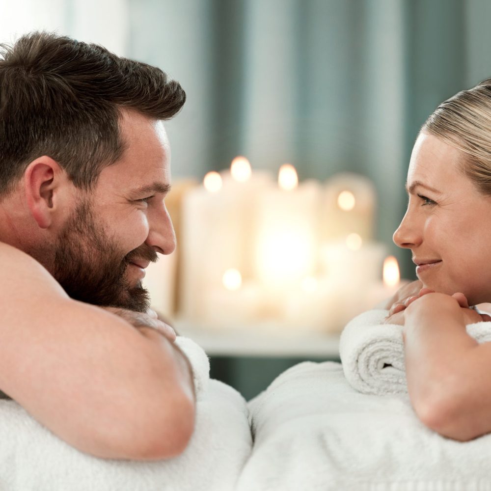 Couple, spa and facing luxury massage together for healthy, relax and wellness at a holiday resort