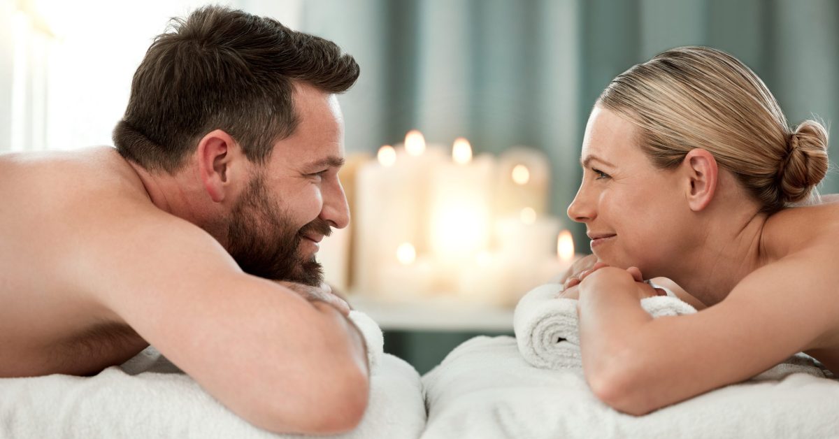 Couple, spa and facing luxury massage together for healthy, relax and wellness at a holiday resort